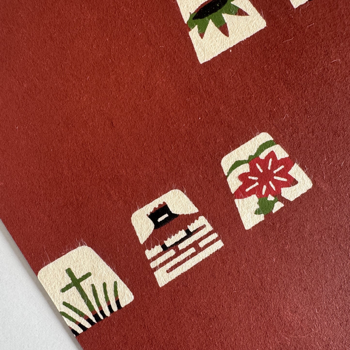 Japanese katazome-shi paper in brown with small Japanese Mon motifs