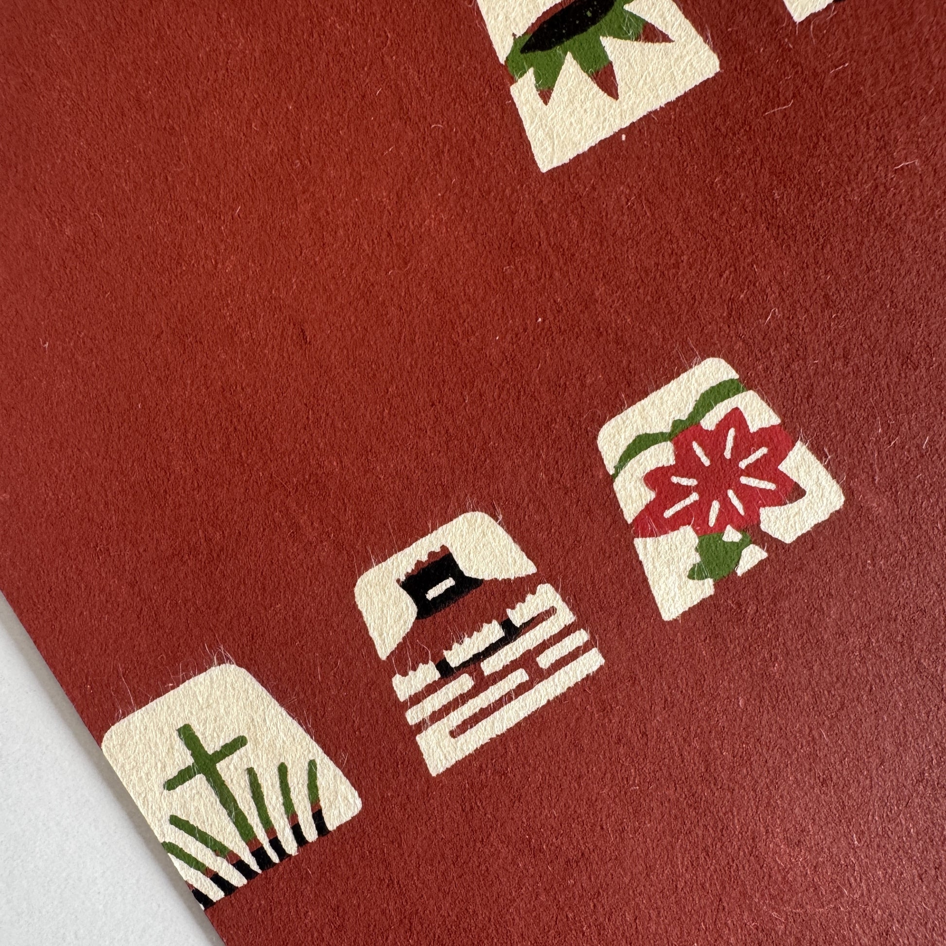 Japanese katazome-shi paper in brown with small Japanese Mon motifs
