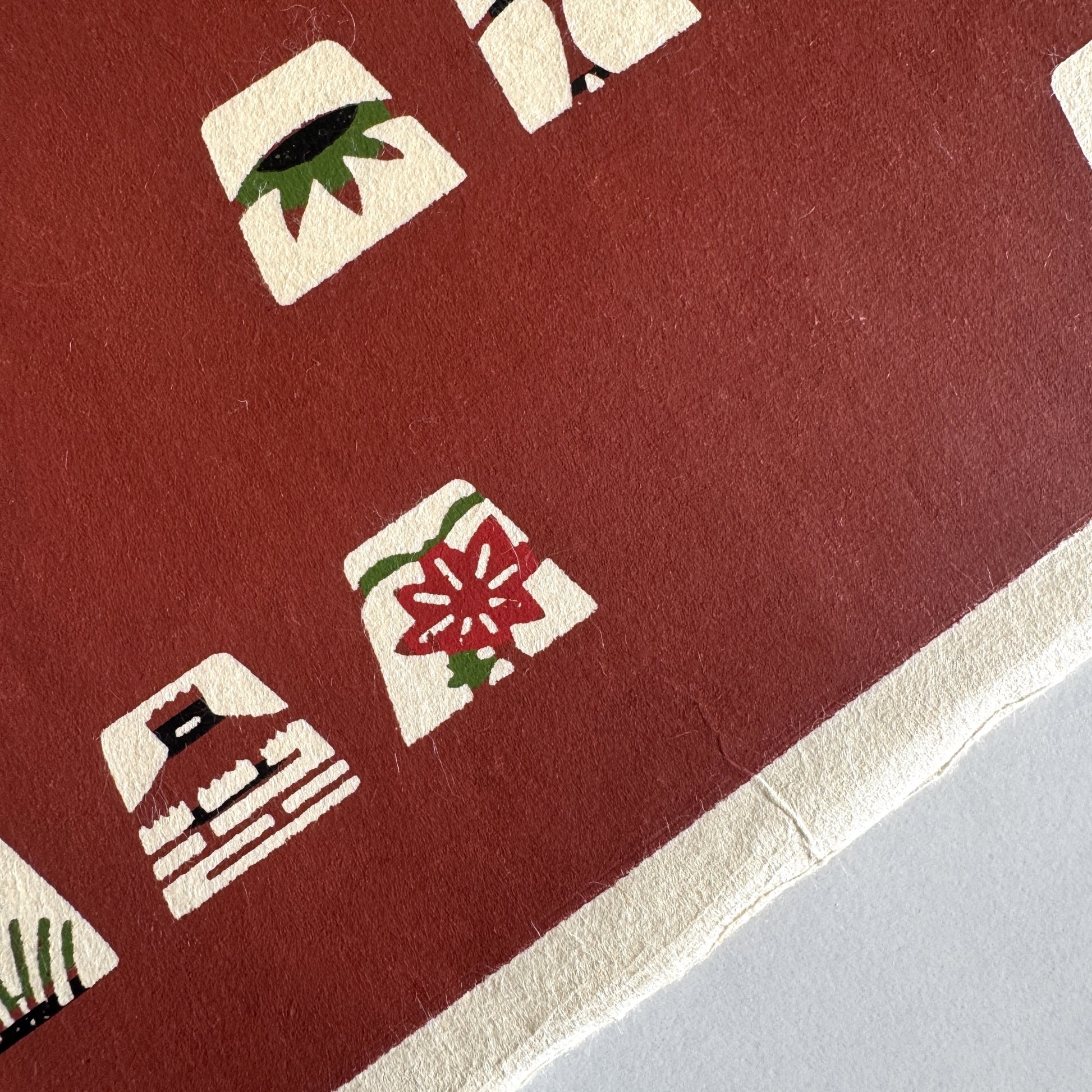 Japanese katazome-shi paper in brown with small Japanese Mon motifs