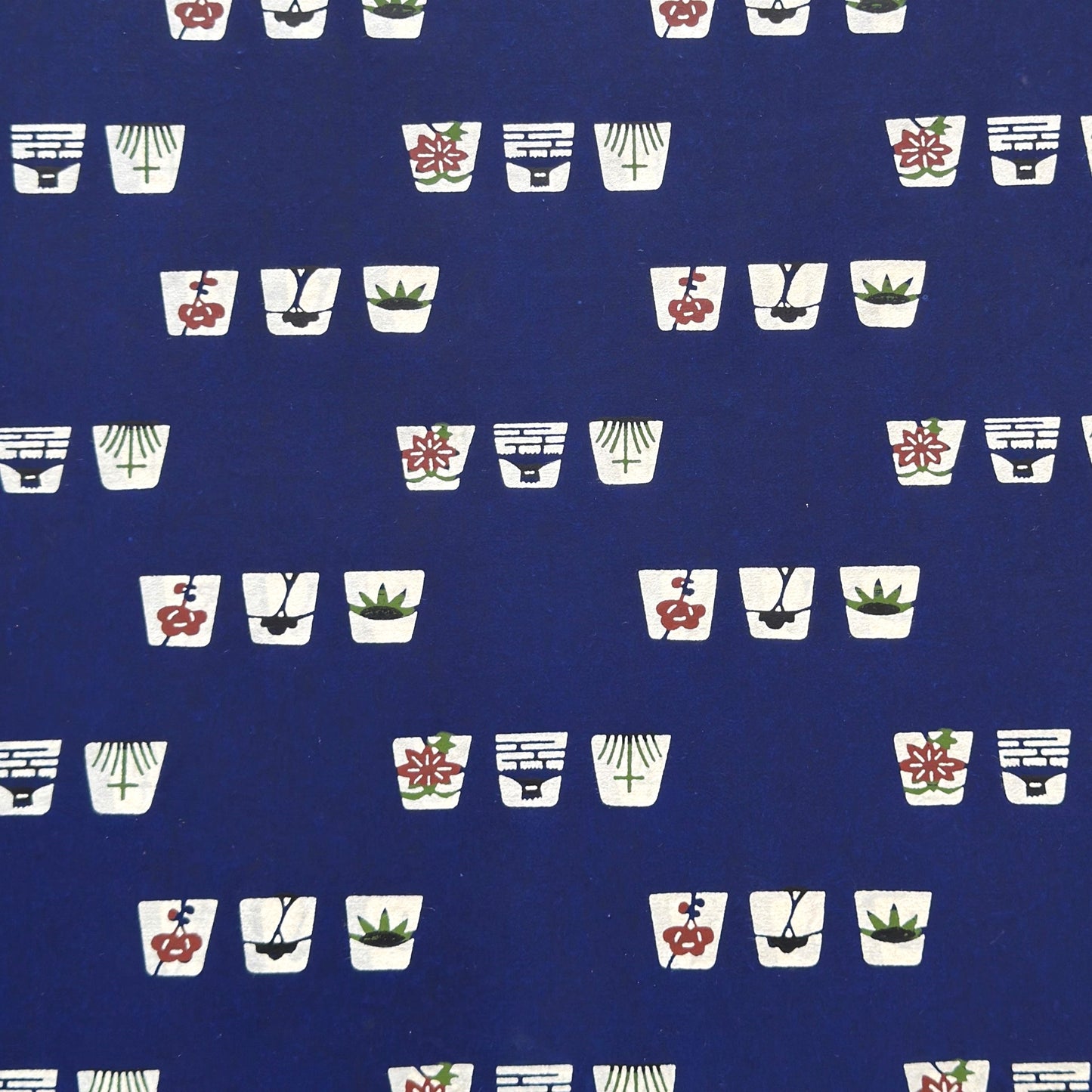 Japanese katazome-shi paper in blue with small Japanese Mon motifs