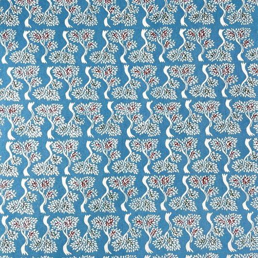 japanese stencil-dyed handmade paper with bonsai tree repeat pattern on blue backdrop