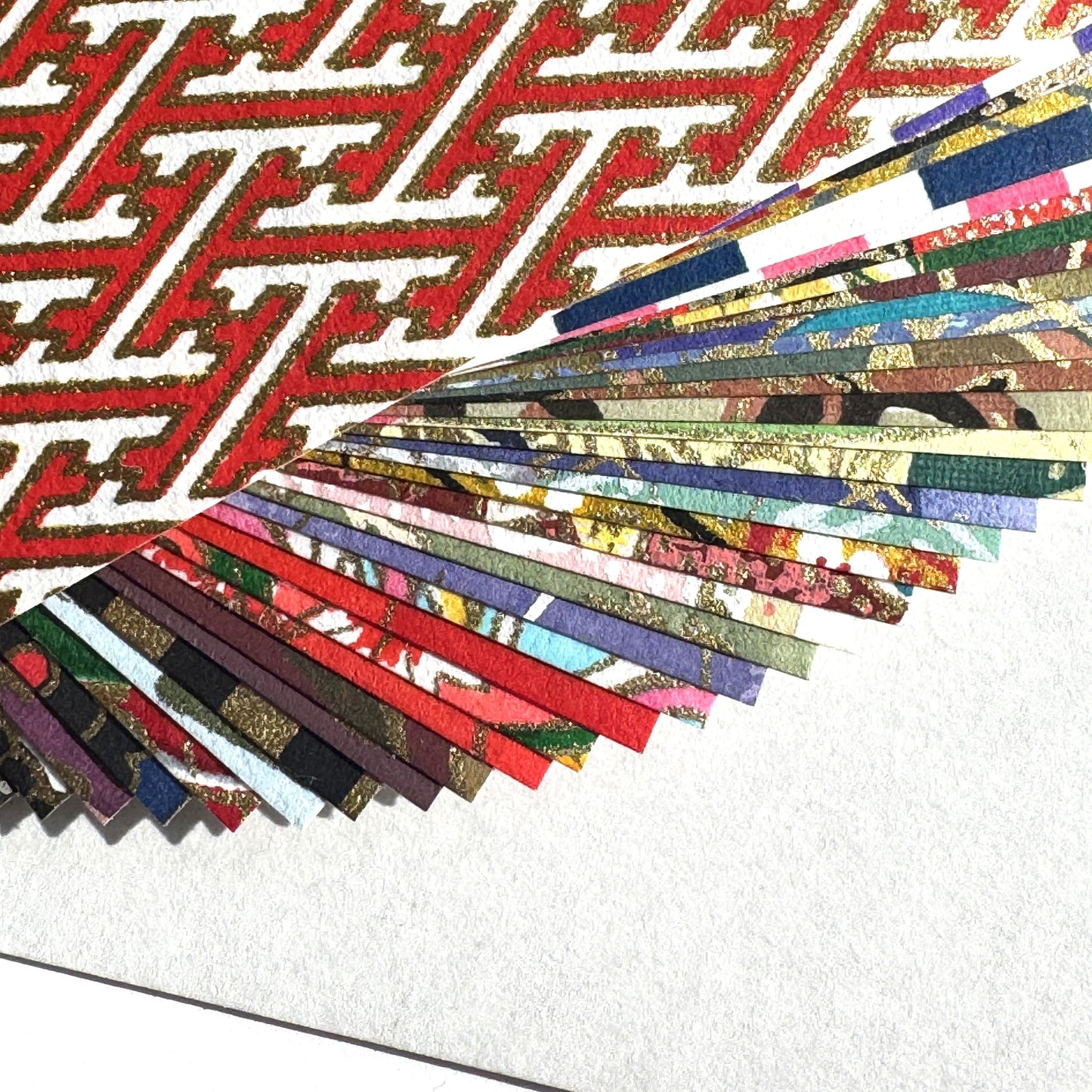 a pack of 40 sheets of origami squares made from the finest yuzen chiyogami patterned paper. Close up of the papers