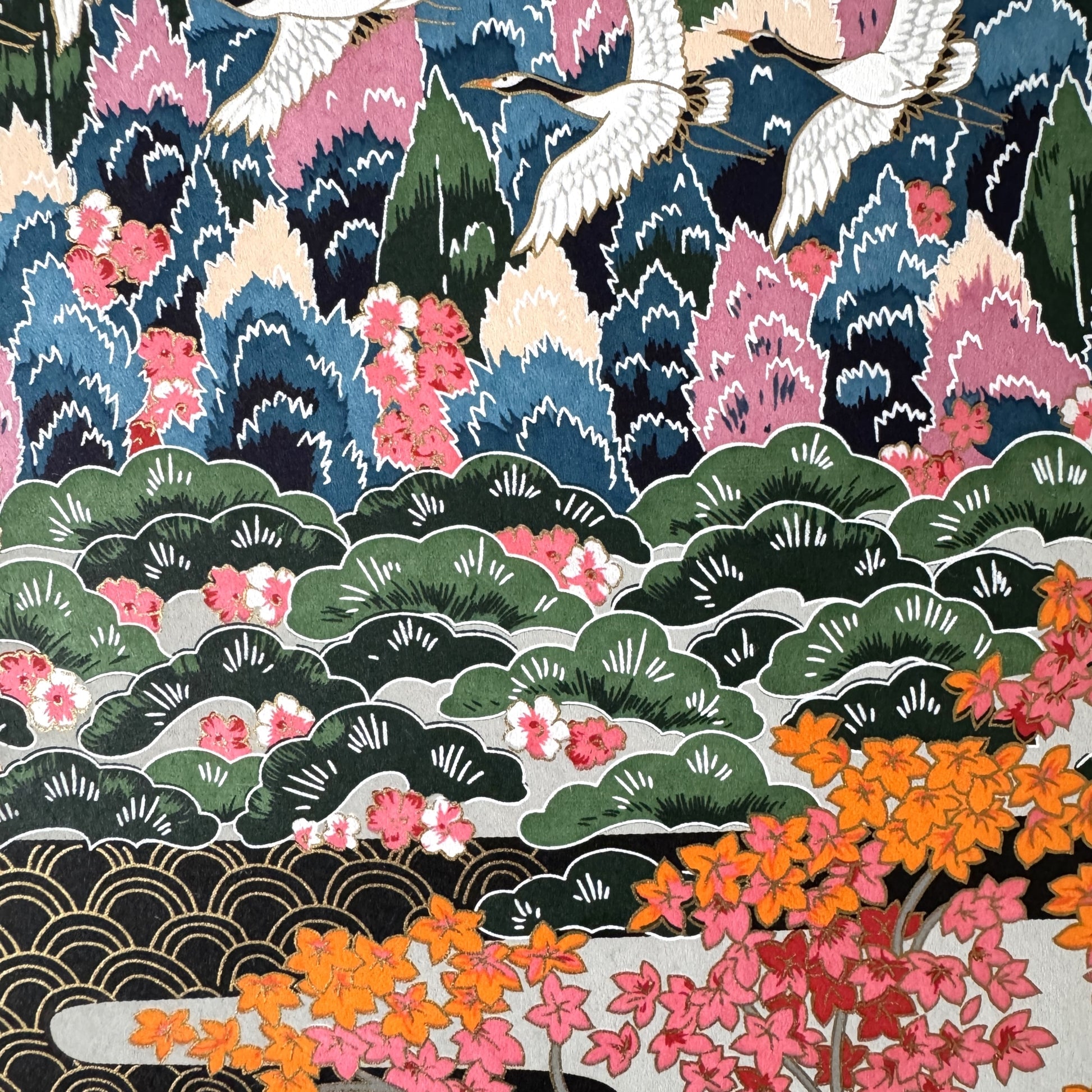 A sheet of Japanese silkscreen printed paper called Sogara which depicts a colourful forest with rivers and mountains in the background.  Close up of the forest with cranes flying.