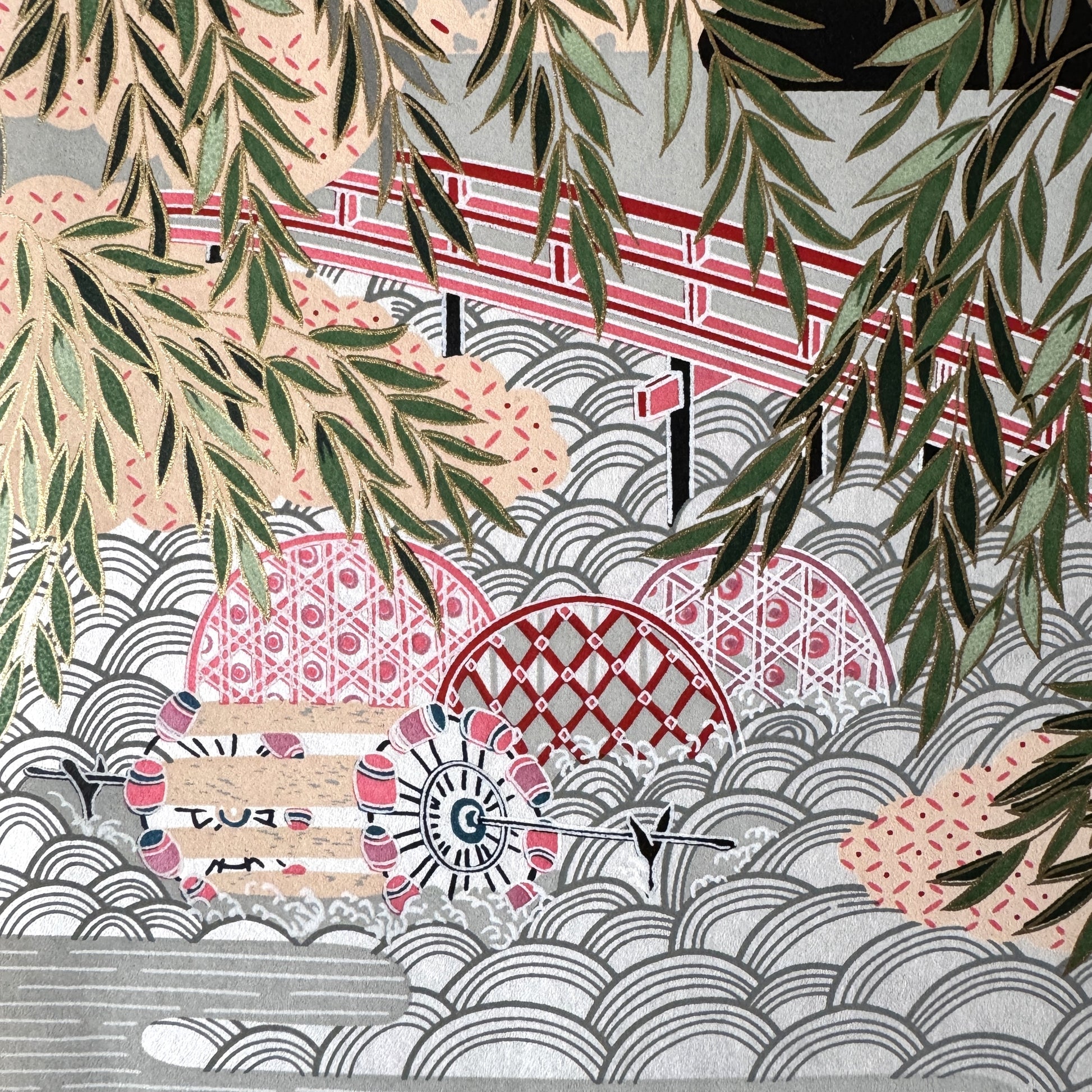 A sheet of Japanese silkscreen printed paper called Sogara which depicts a colourful forest with rivers and mountains in the background. Close up of a bridge