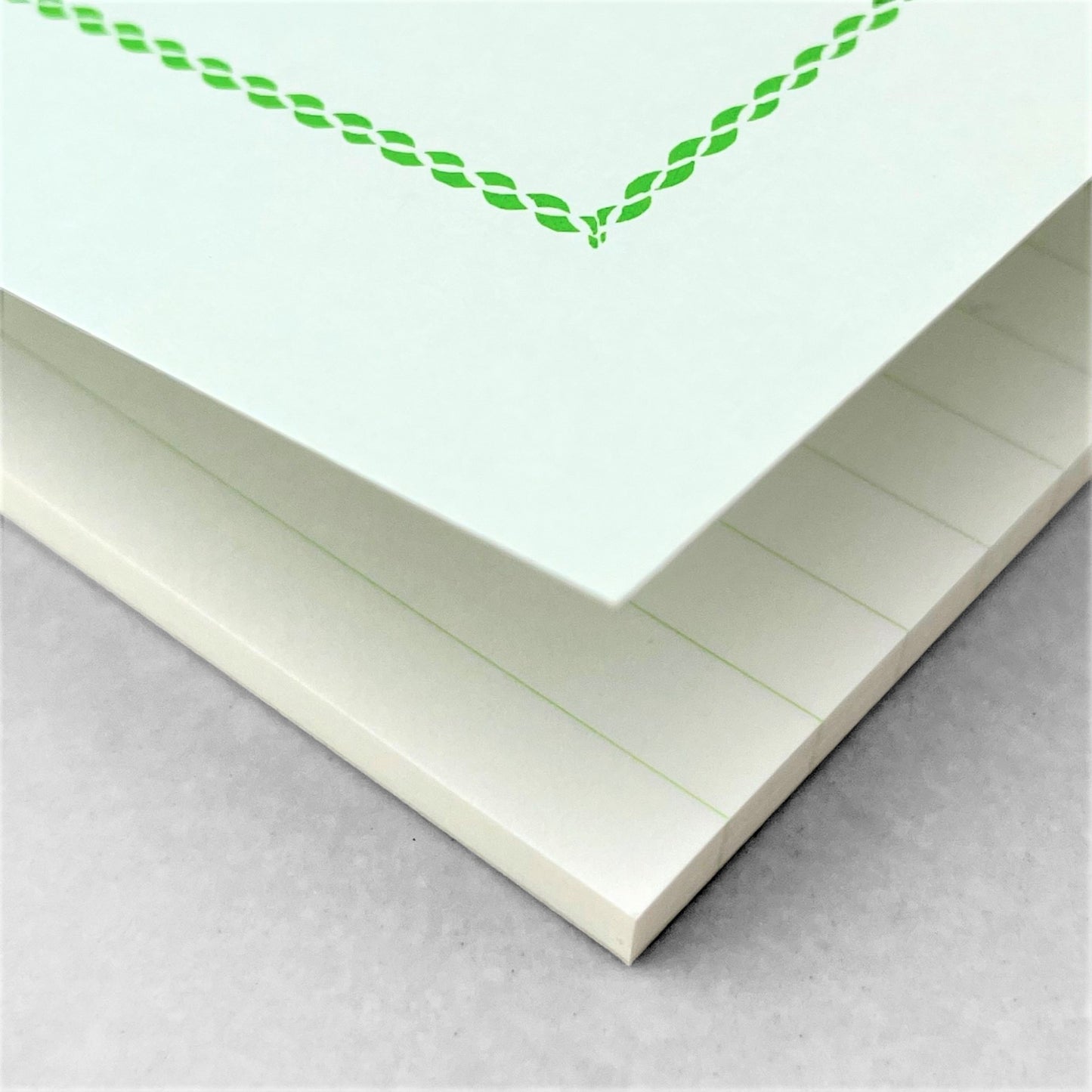 A5 softcover notebook with a soft green cover with green border and branding by Japanese brand Life Japan
