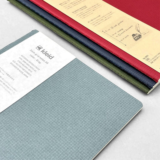 A5 soft cover notebook, cover is grey with a small white grid pattern. by Japanese brand Kleid