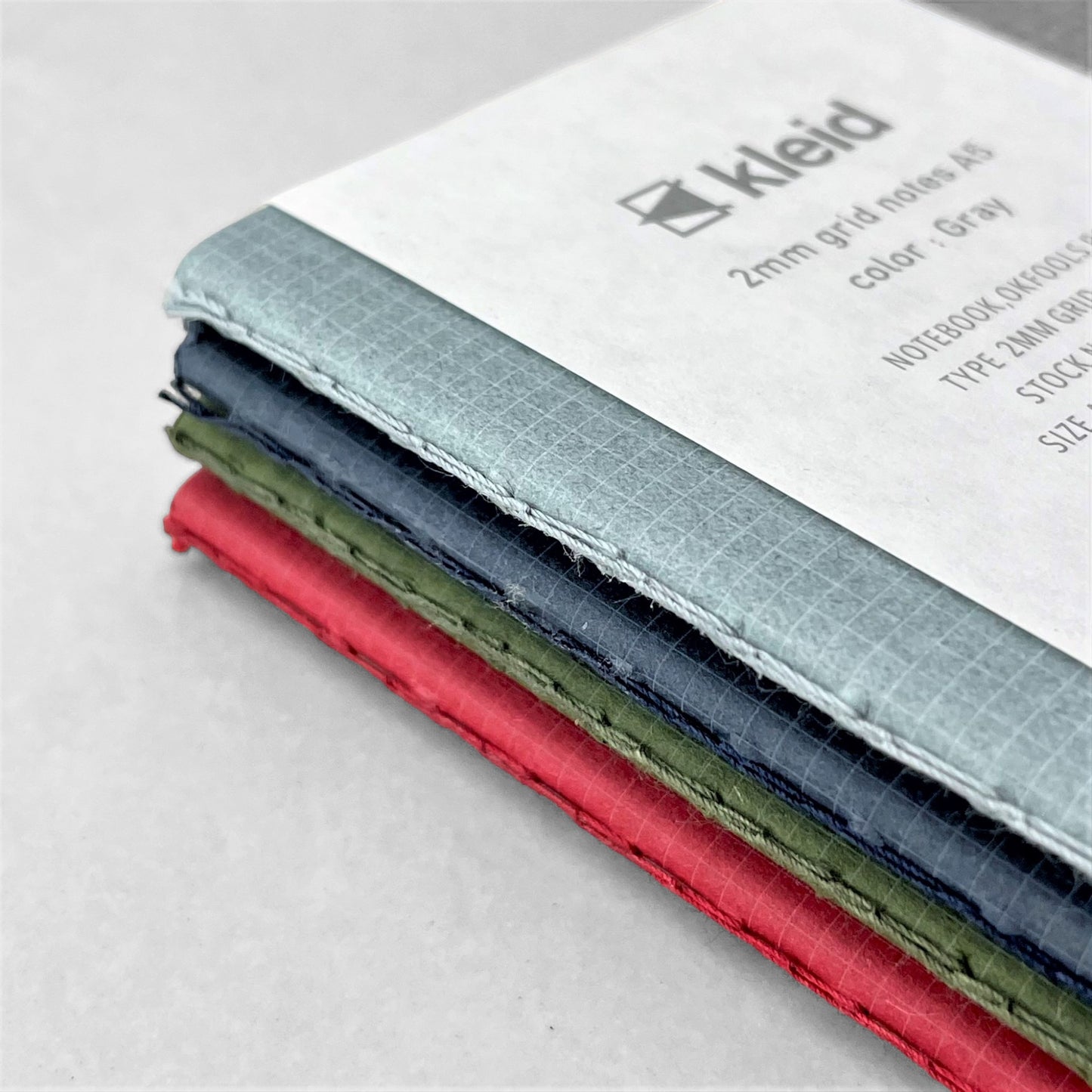 A5 soft cover notebook, cover is grey with a small white grid pattern. by Japanese brand Kleid