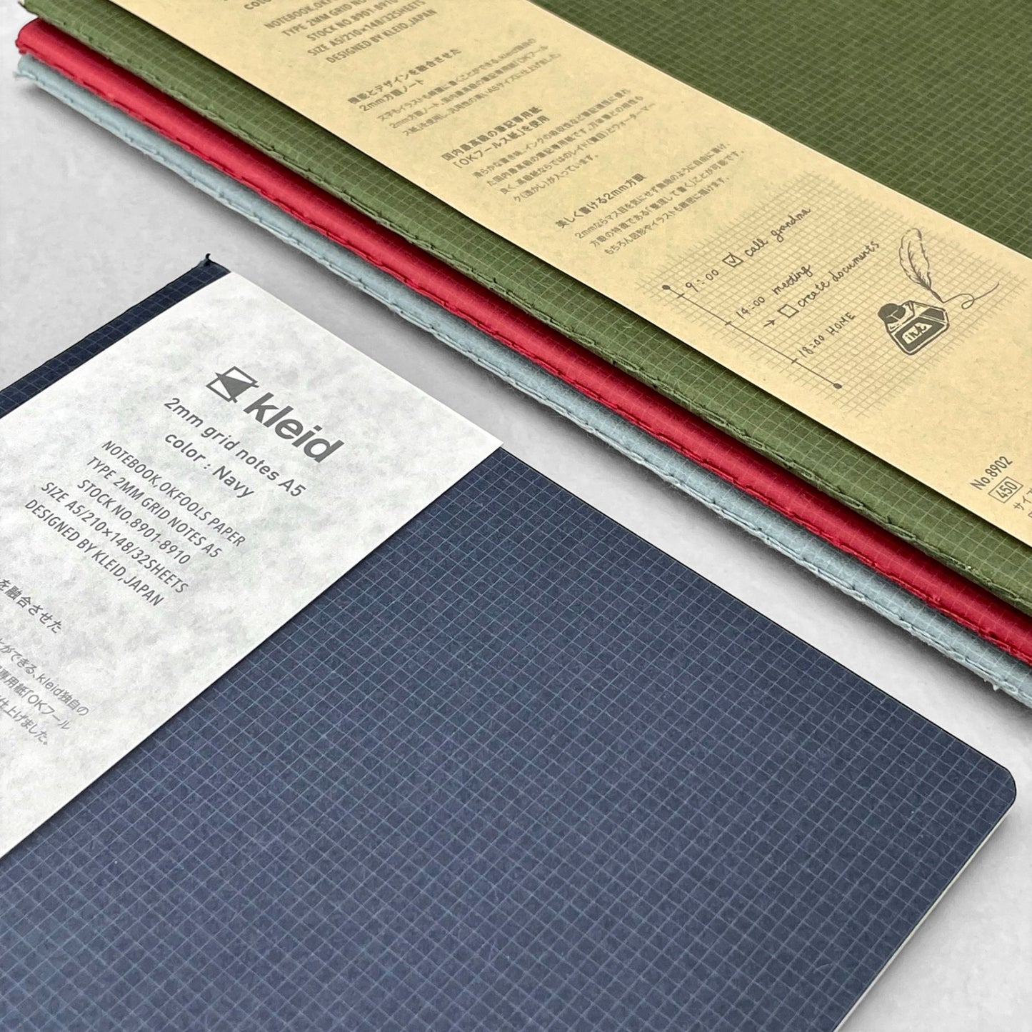 A5 soft cover notebook, cover is navy with a small white grid pattern by Japanese brand Kleid