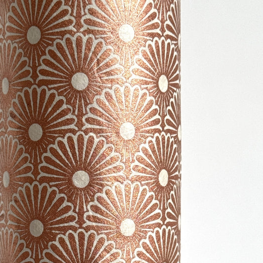 Nepalese handmade decorative lokta paper sheet with a copper metallic repeat floral pattern screen printed on an ivory lokta paper.