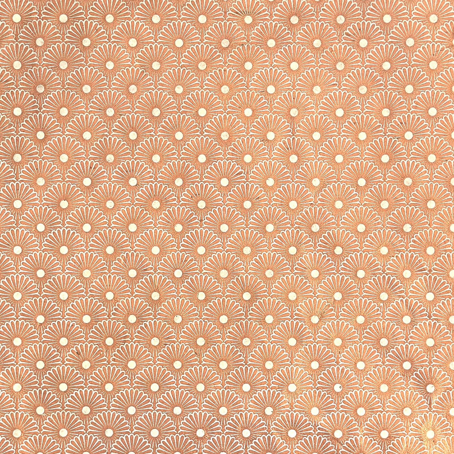 Nepalese handmade decorative lokta paper sheet with a copper metallic repeat floral pattern screen printed on an ivory lokta paper.