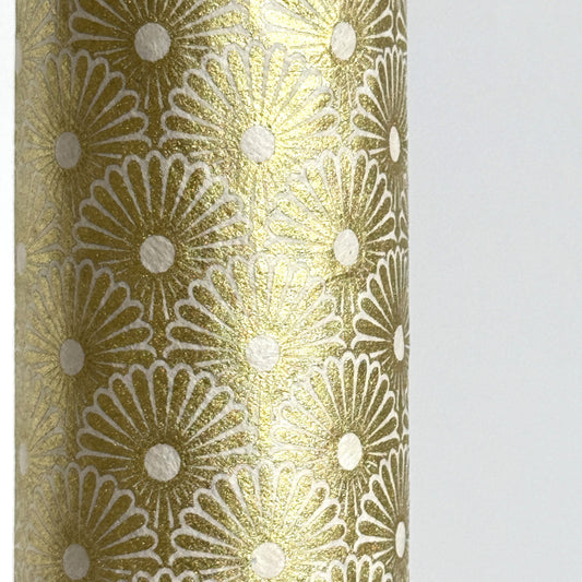 Nepalese handmade decorative lokta paper sheet with a gold metallic repeat floral pattern screen printed on an ivory lokta paper. Close up