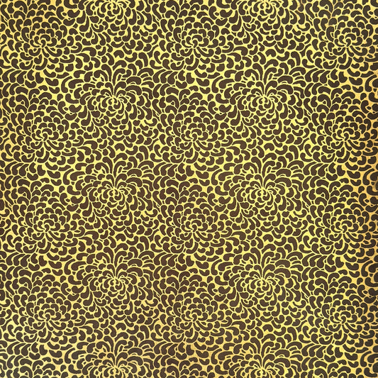 Nepalese handmade decorative lokta paper sheet with a gold screen printed floral design on a brown dyed lokta paper.