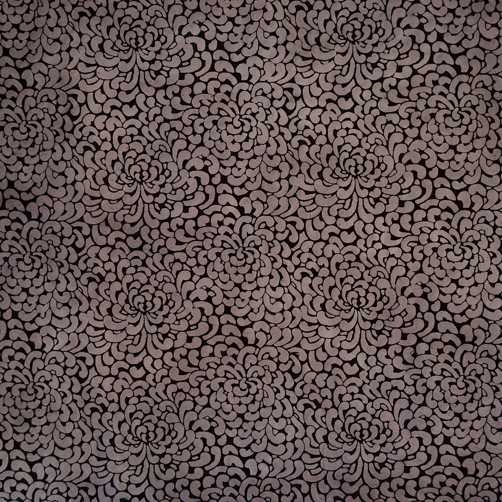 Nepalese handmade lokta paper sheet with a screen printed black floral design on slate lokta paper