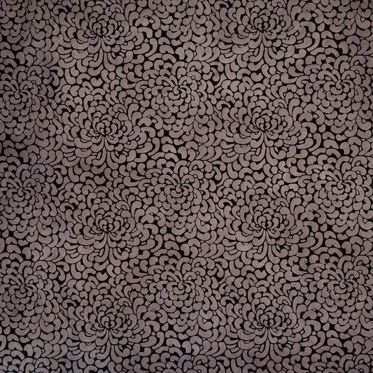 Nepalese handmade lokta paper sheet with a screen printed black floral design on slate lokta paper