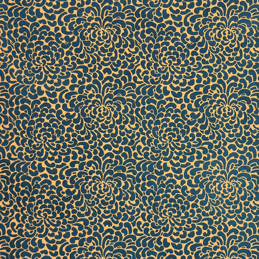Nepalese handmade decorative lokta paper sheet with a saffron floral print screen printed on a teal lokta paper