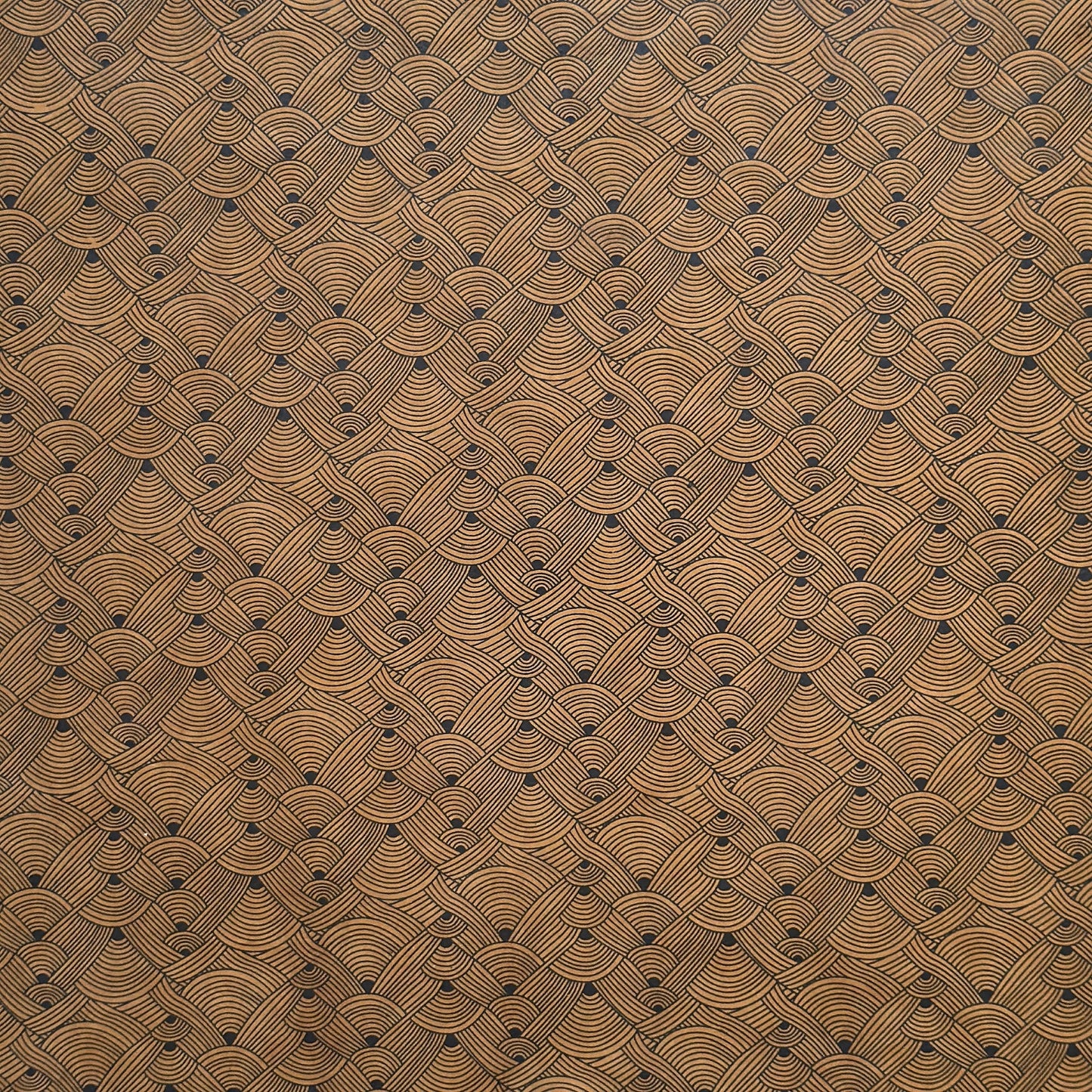 Nepalese handmade decorative lokta paper sheet with a fine lined black knots pattern screen printed on a brown lokta paper.