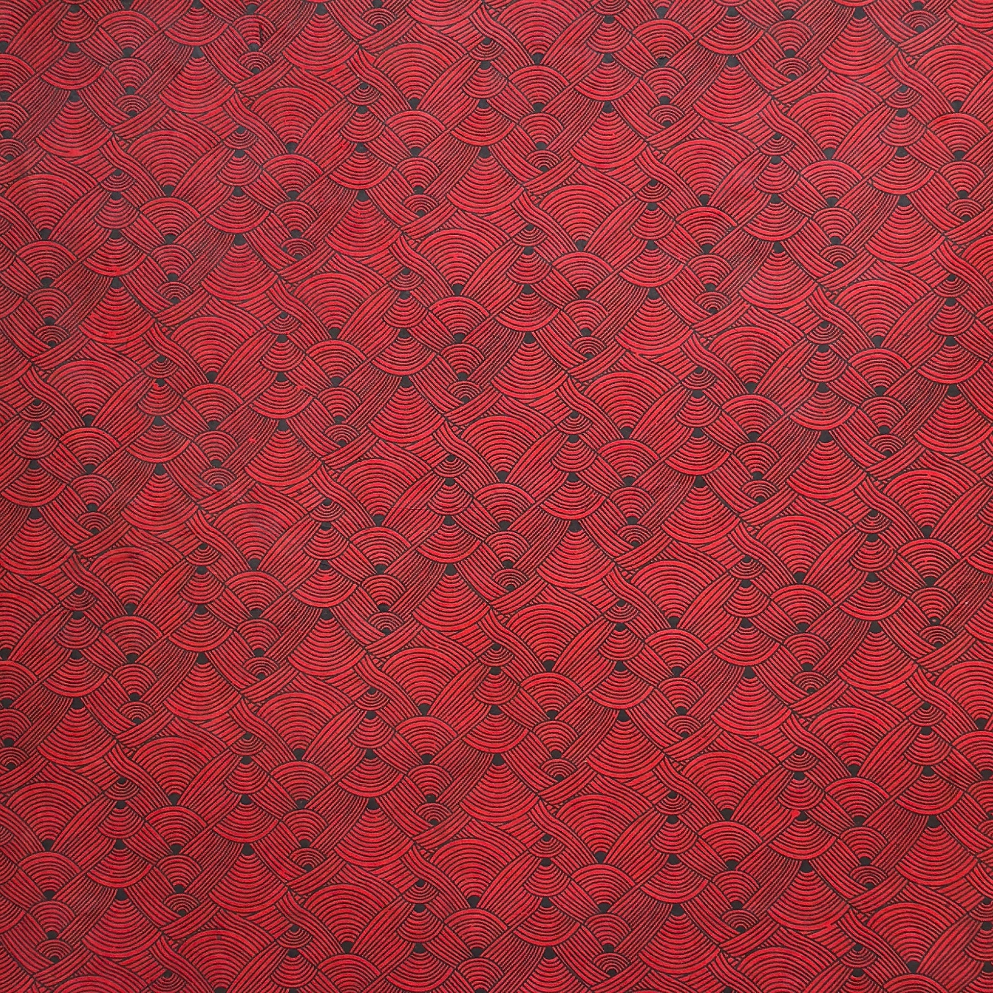 Nepalese handmade decorative lokta paper sheet with a fine lined black knots pattern screen printed on a red lokta paper.