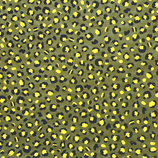 Nepalese handmade decorative lokta paper sheet with an animal print design in two colours, yellow and black, screen printed on a green lokta paper.