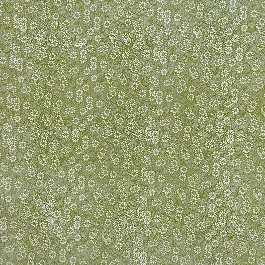 Nepalese handmade decorative lokta paper sheet with a white ditsy floral design screen printed on a green lokta paper.