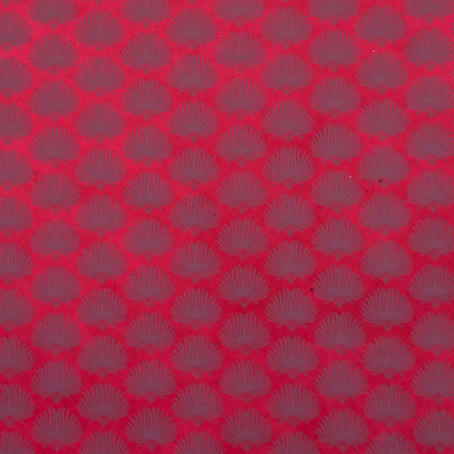 Nepalese handmade decorative lokta paper sheet with a lilac palm leaf design screen printed on a fuchsia pink lokta paper.