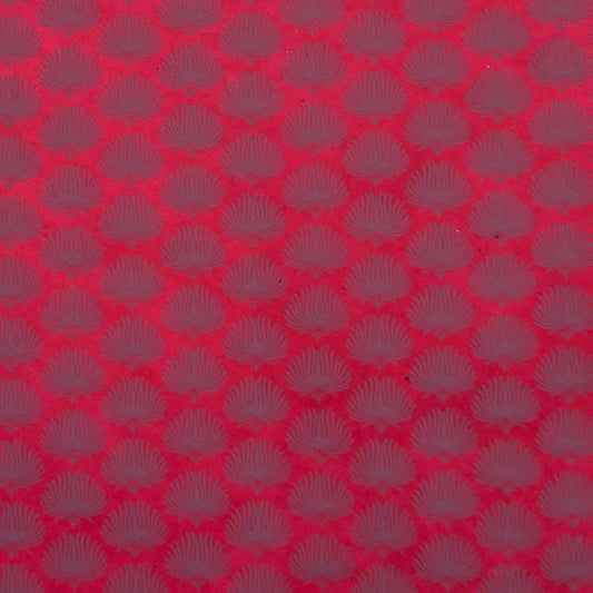 Nepalese handmade decorative lokta paper sheet with a lilac palm leaf design screen printed on a fuchsia pink lokta paper.