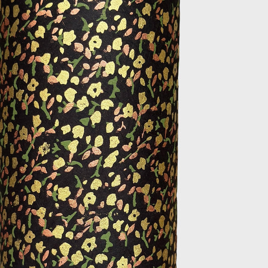 A delicate floral pattern in gold, blush and green screen-printed by hand on black lokta paper.