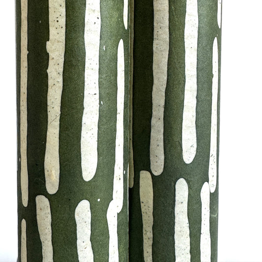 Nepalese handmade decorative lokta paper sheet with a stripe pattern in mossy and white.  Batik dyed using carved wooden blocks. Close up