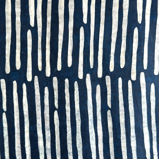 Nepalese handmade decorative lokta paper sheet with a stripe pattern in petrol blue and white.  Batik dyed using carved wooden blocks