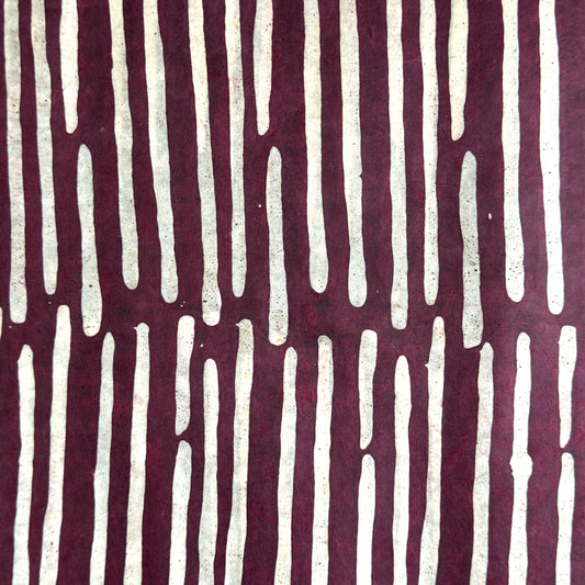Nepalese handmade decorative lokta paper sheet with a stripe pattern in burgundy and white.  Batik dyed using carved wooden blocks