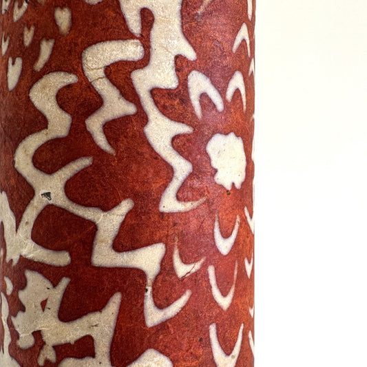 Nepalese handmade decorative lokta paper sheet with a floral pattern in rust and cream. Batik dyed using carved wooden blocks.
