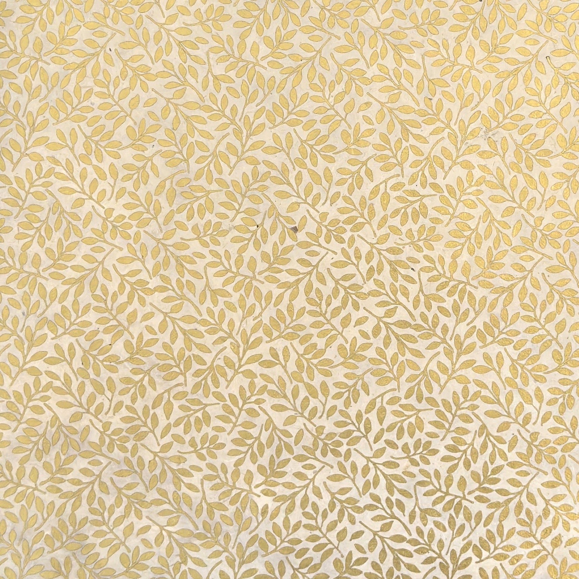 Nepalese handmade decorative lokta paper sheet with a metallic gold willow design screen printed on an ivory lokta paper.