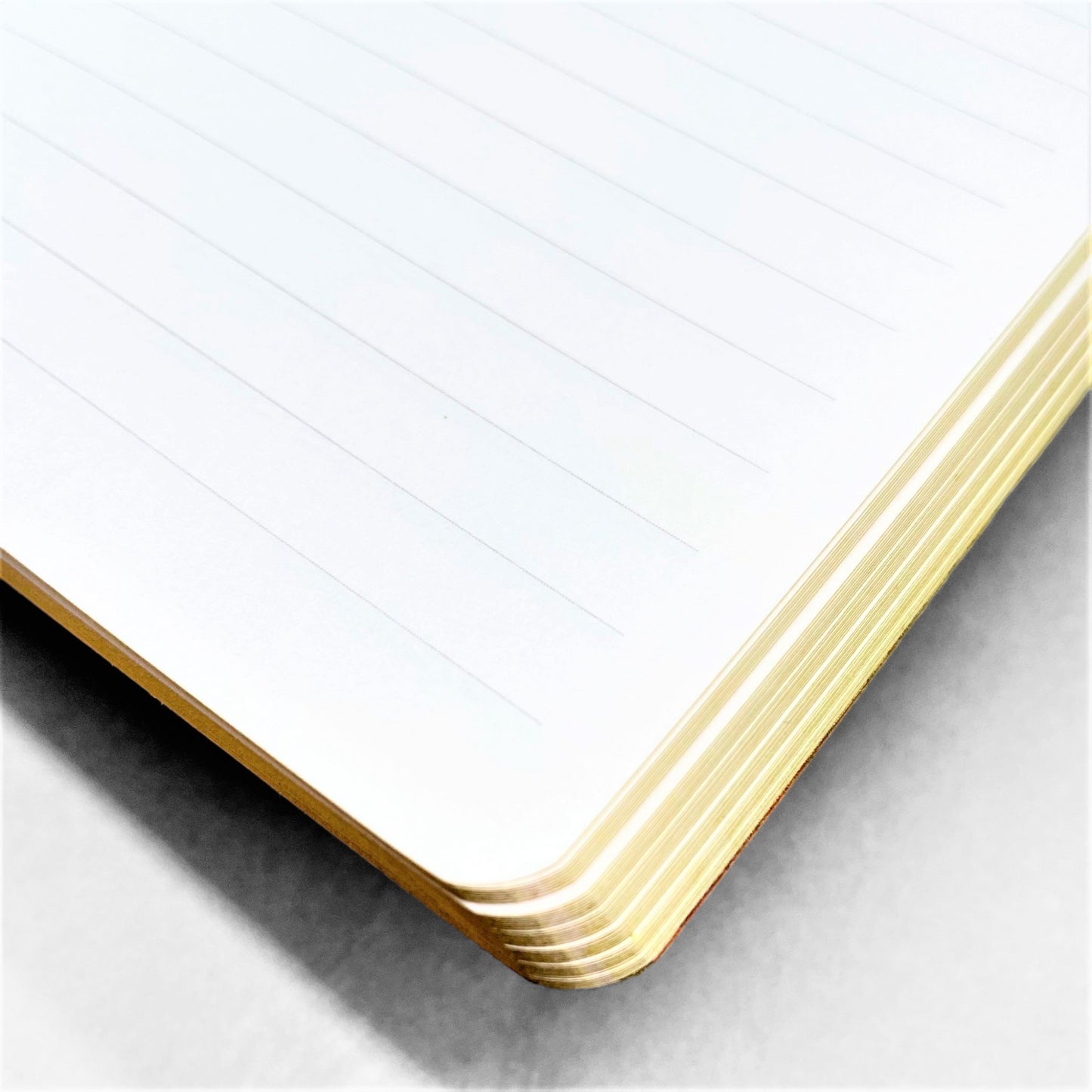 A5 lined notebook with a japanese cover design with white swans on an orange background