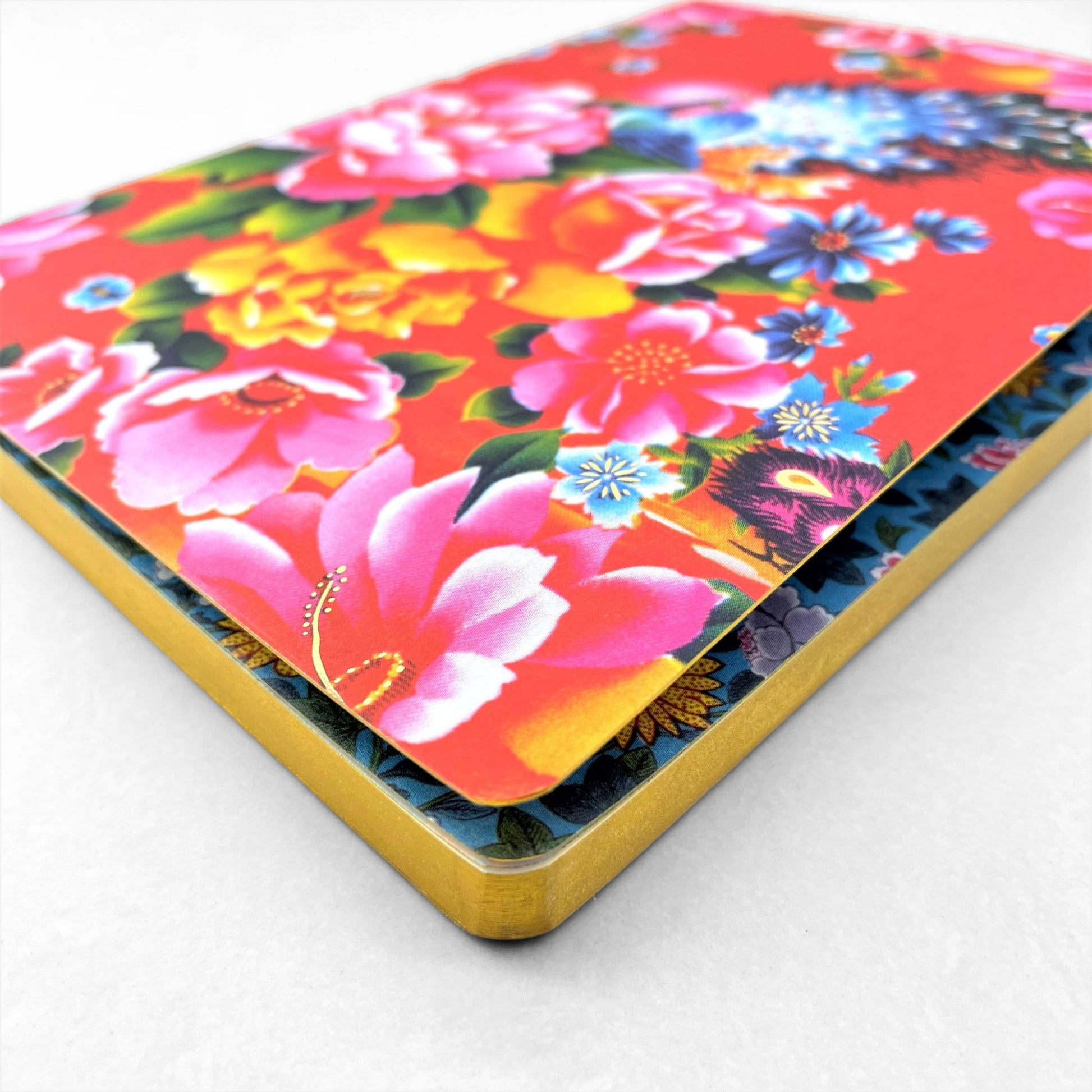A5 lined notebook with a chinese design of peacock and flowers on a red background