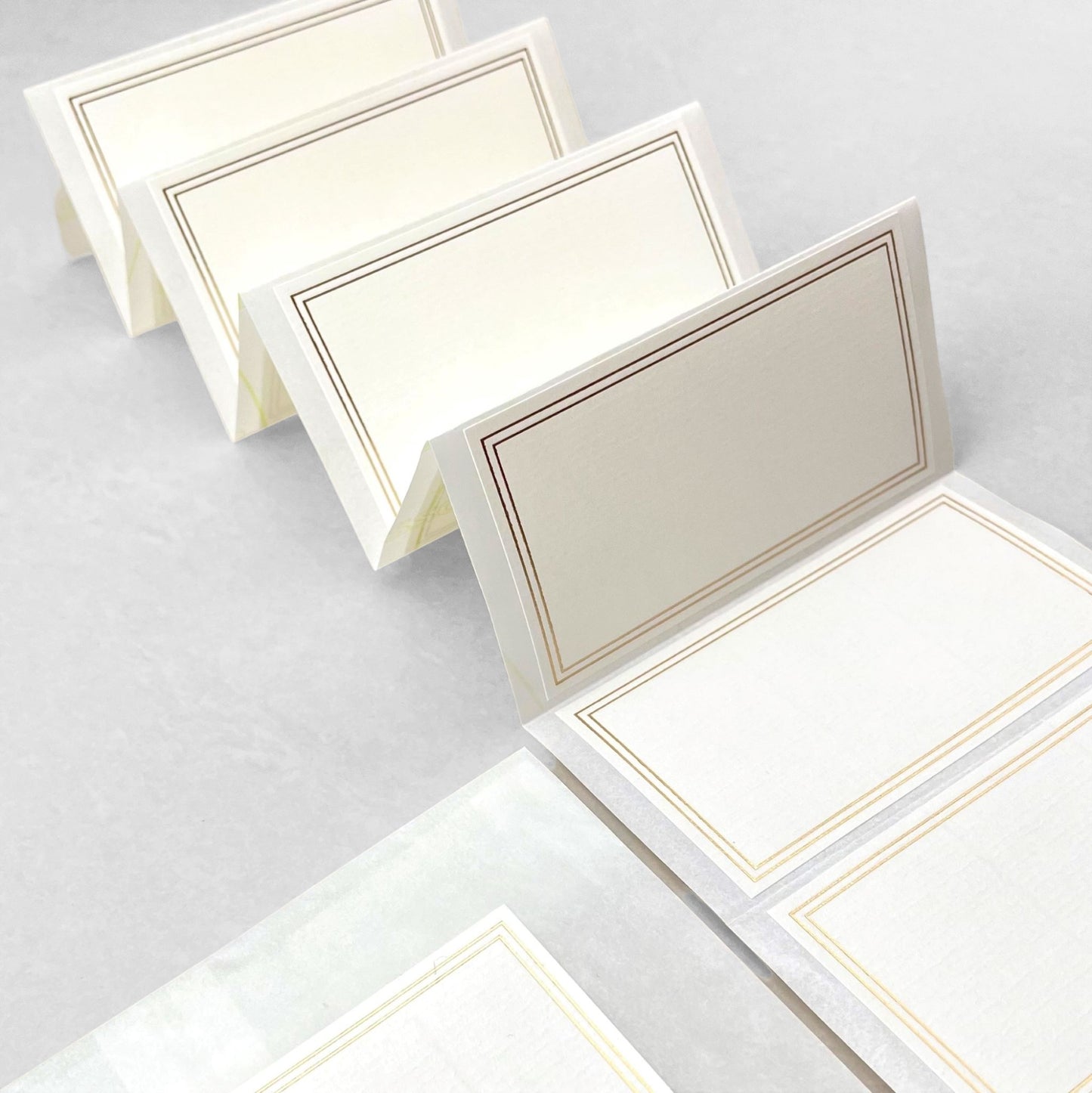 Pack of 10 self-adhesive white labels with double lined gold brass foiled border, by Ola Studio