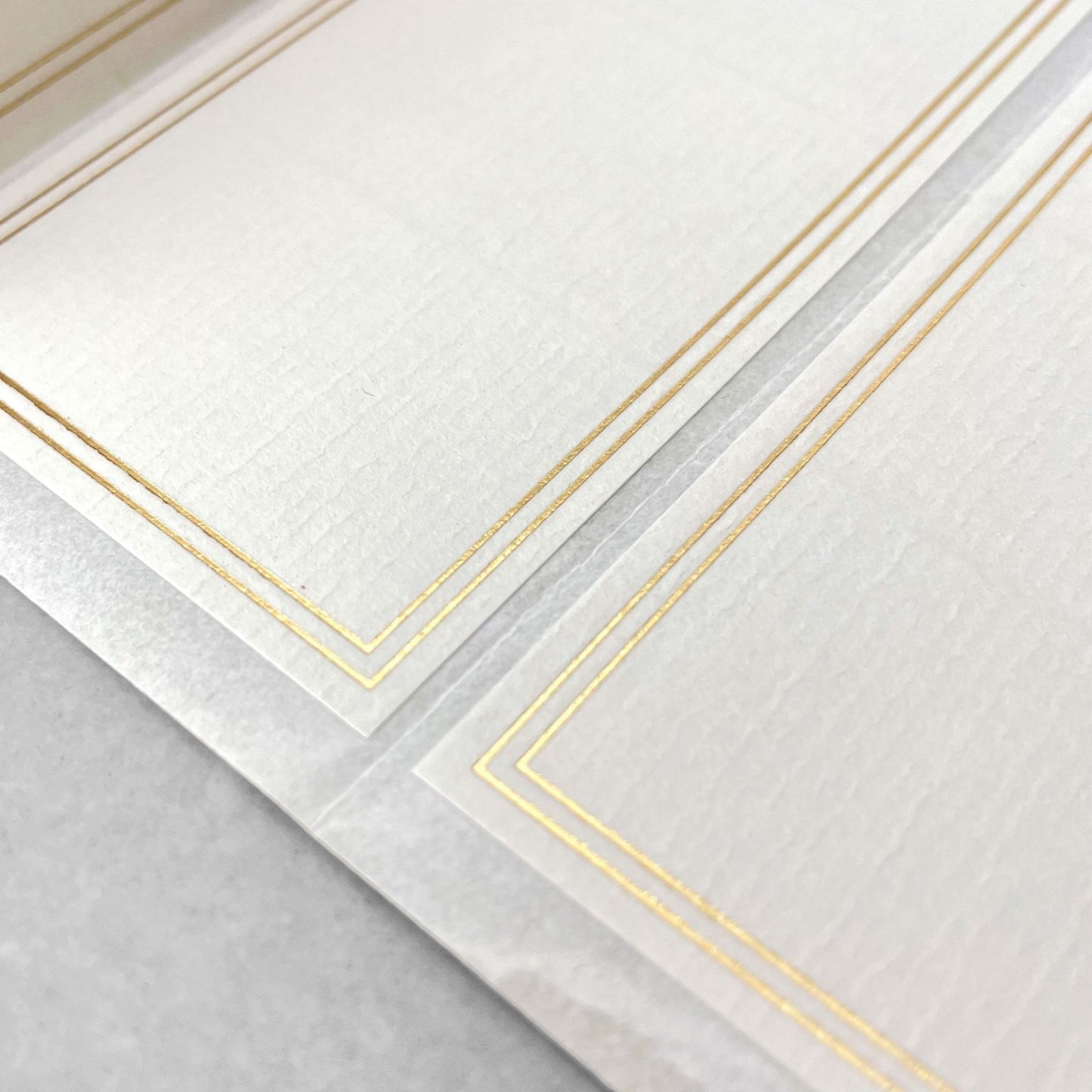 Pack of 10 self-adhesive white labels with double lined gold brass foiled border, by Ola Studio