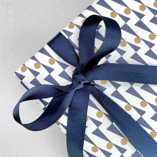 Luxury dark navy satin ribbon on a rectangular board, by Ola Studio, shown as a bow