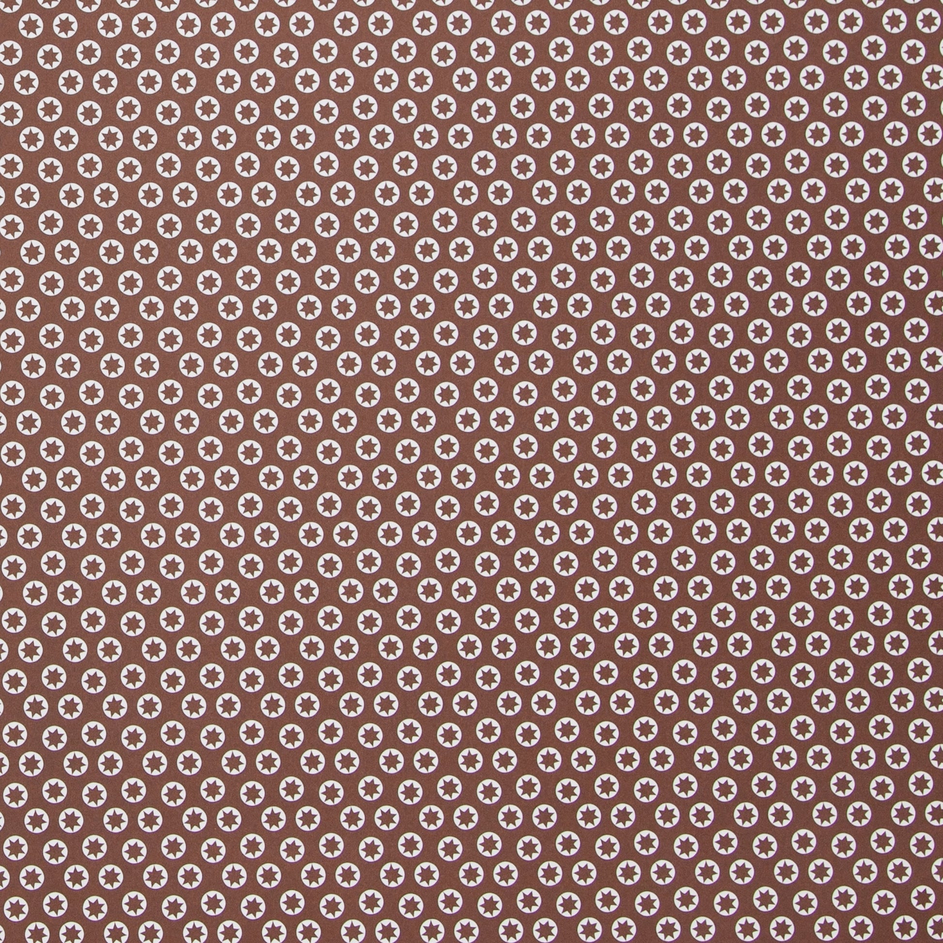 wrapping paper with an abstract tiny stars pattern in chestnut brown and white by Ola Studio