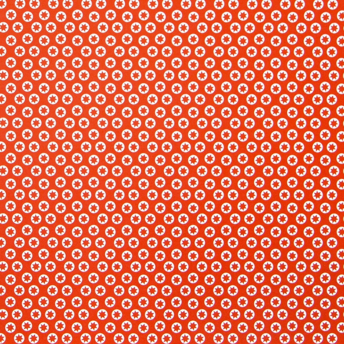wrapping paper with an abstract tiny stars pattern in red and white by Ola Studio