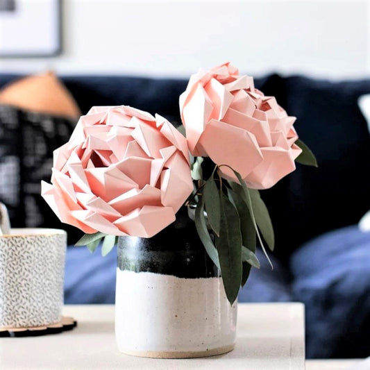 Two pink paper peonies in a vase, made from a paper craft kit, by Origami Est