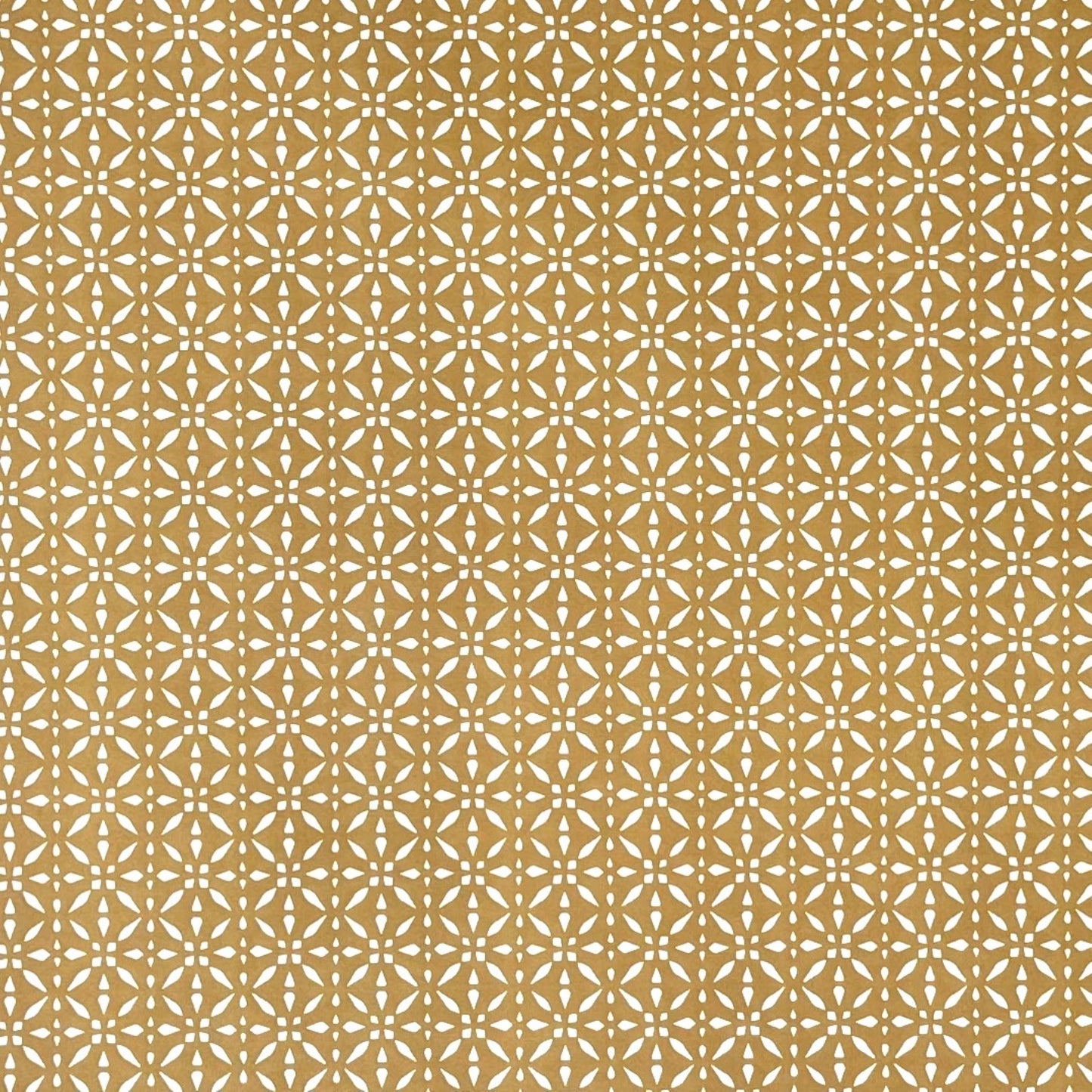 wrapping paper by Otto Editions with a cut-out design in white on a gold background.