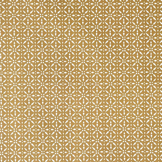 wrapping paper by Otto Editions with a cut-out design in white on a gold background.