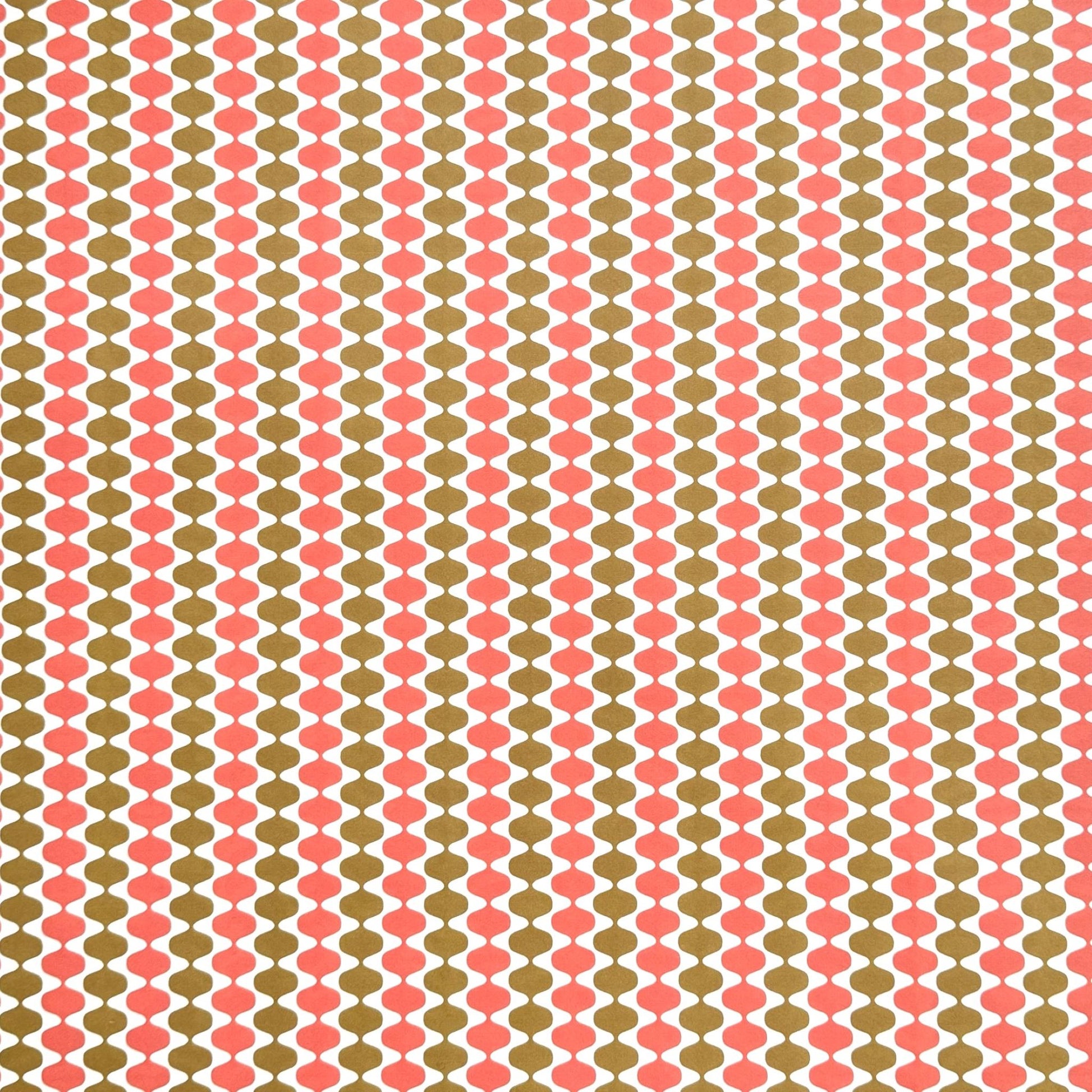 wrapping paper by Otto Editions with a cut-out wavy design in white on a coral and gold background.