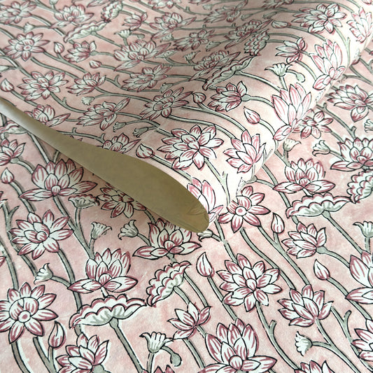 hand block printed wrapping paper by Paper Mirchi. Lotus flower repeat pattern in pale pink