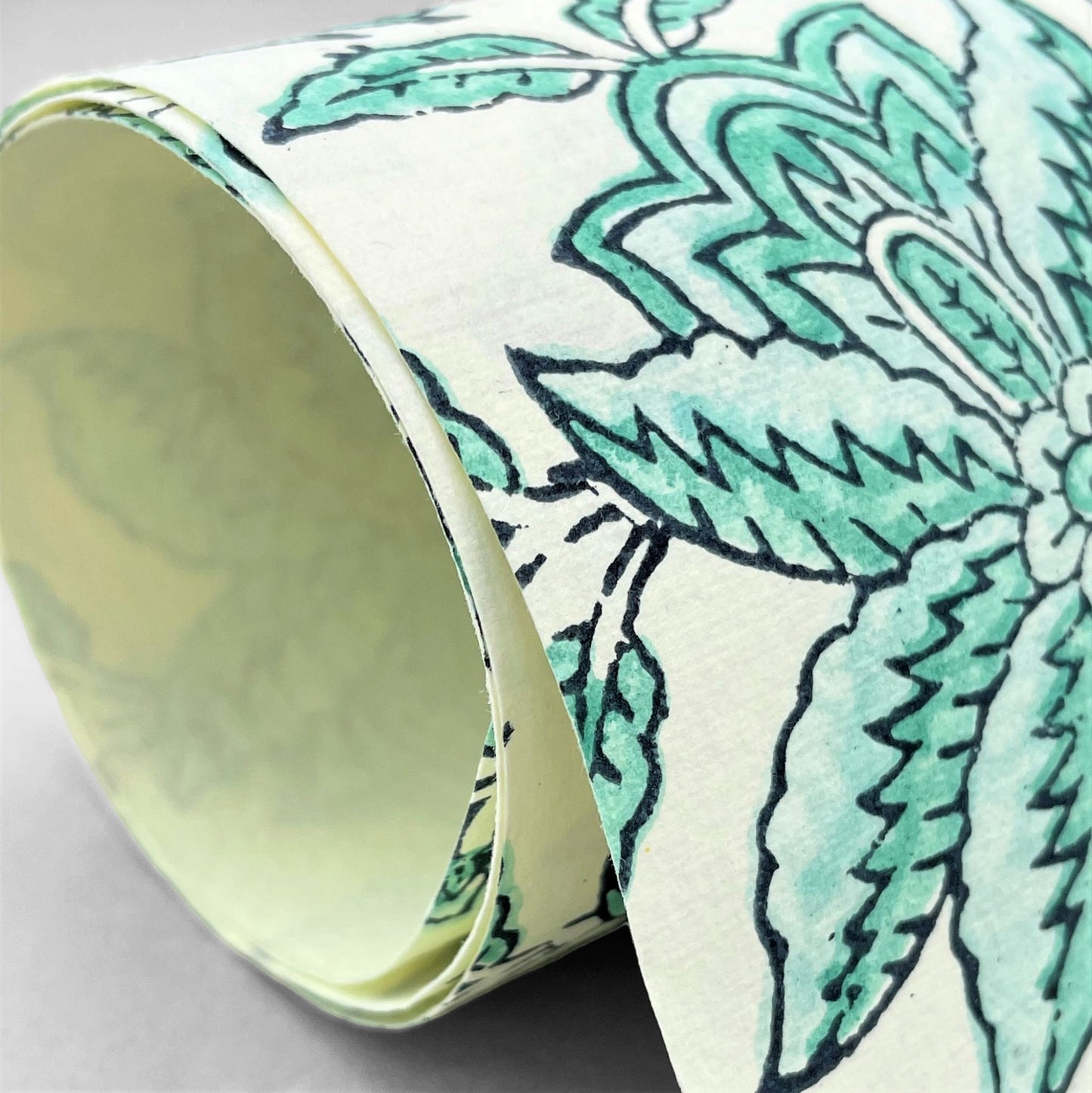wrapping paper with repeat botanical floral pattern in light aqua by Paper Mirchi