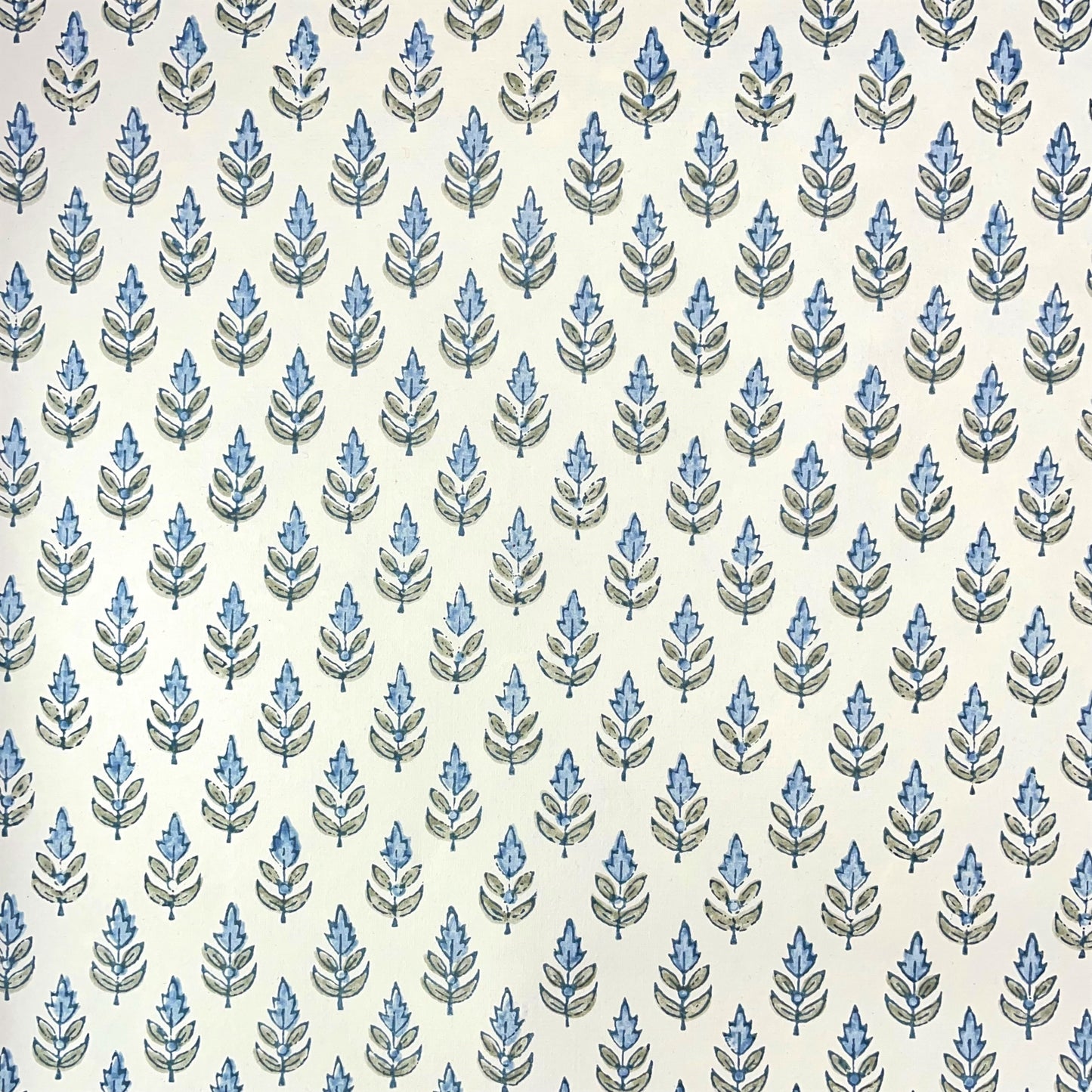 Wrapping paper with block print small flower motif in blue and grey-green, white background by Paper Mirchi