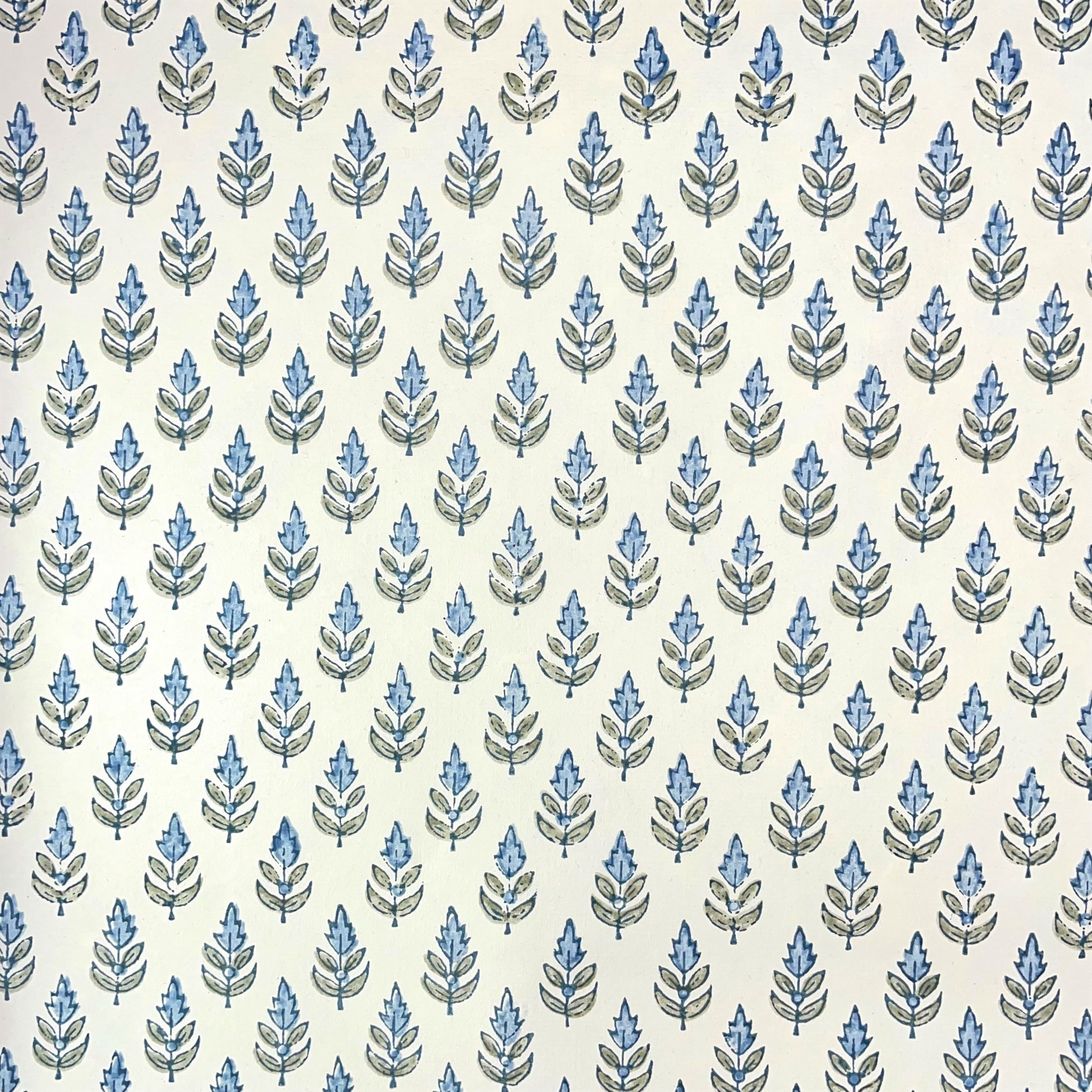 Wrapping paper with block print small flower motif in blue and grey-green, white background by Paper Mirchi