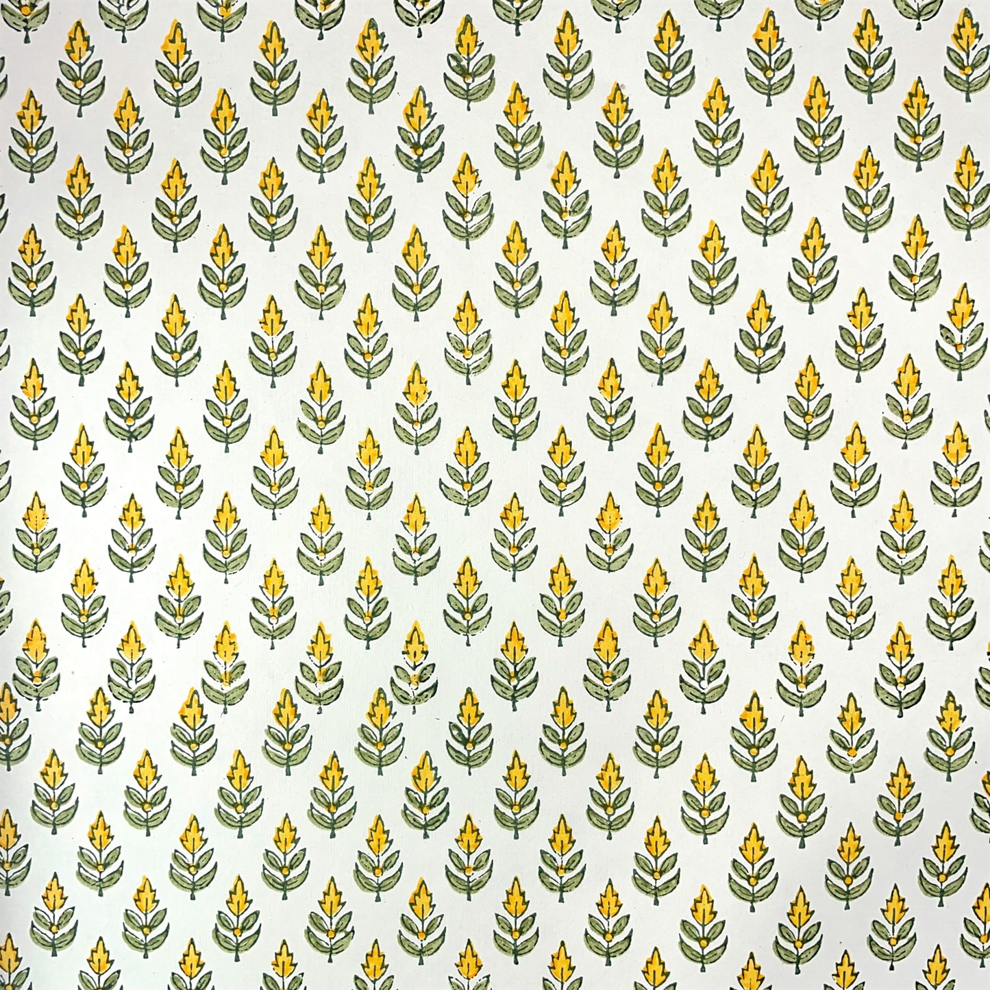 Wrapping paper with block print small flower motif in yellow and green, white background by Paper Mirchi