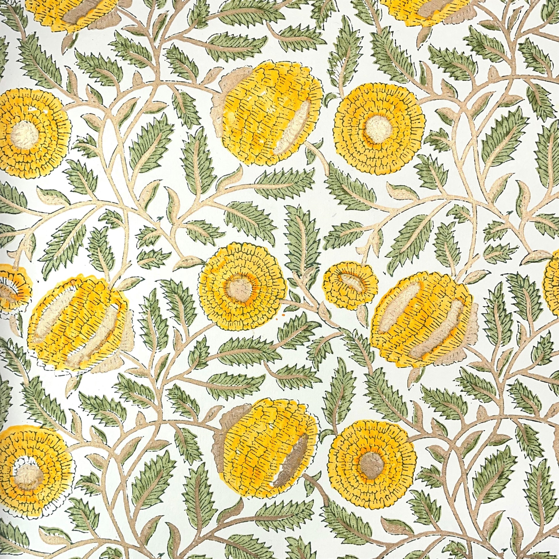wrapping paper with repeat botanical pattern in yellow, gold and green by Paper Mirchi