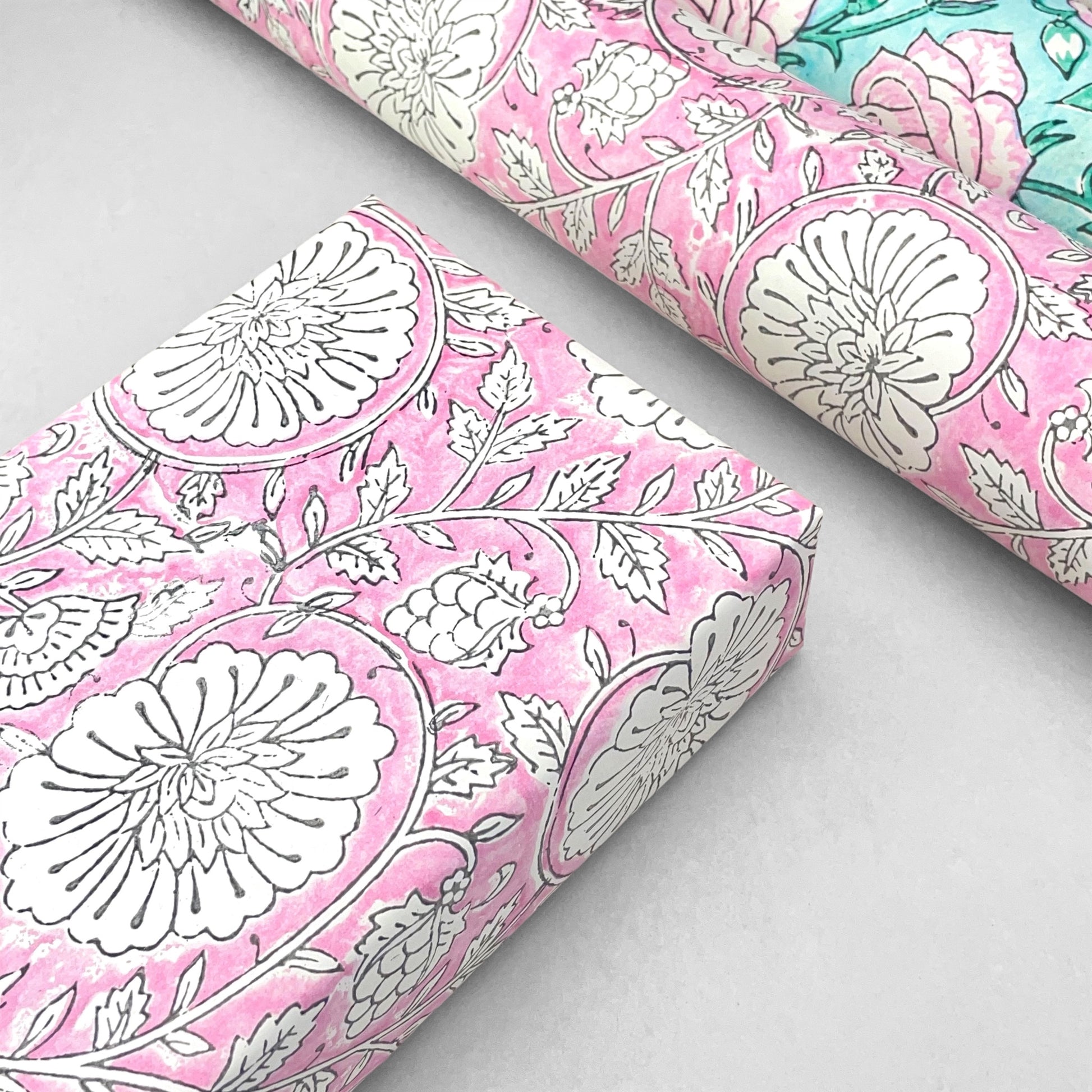 wrapping paper with repeat botanical pattern in pink by Paper Mirchi
