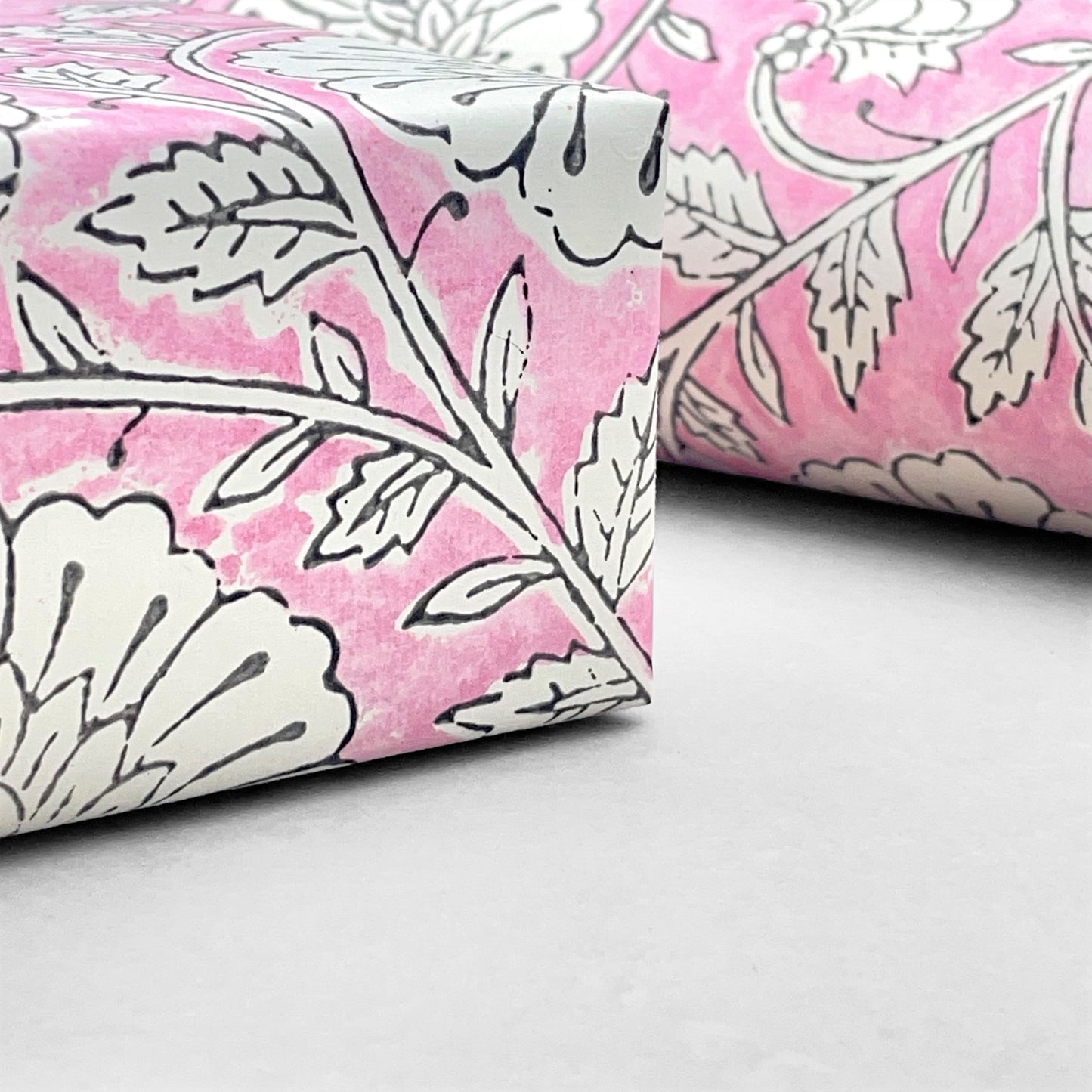 wrapping paper with repeat botanical pattern in pink by Paper Mirchi